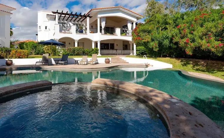 Modern homes for sale in Palmilla hillside smart estate showcasing glass walls, open floor plan, and elevated ocean views